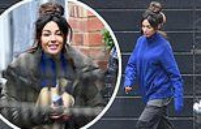 Michelle Keegan cosies up to water bottle as she braves the chilly weather to ...