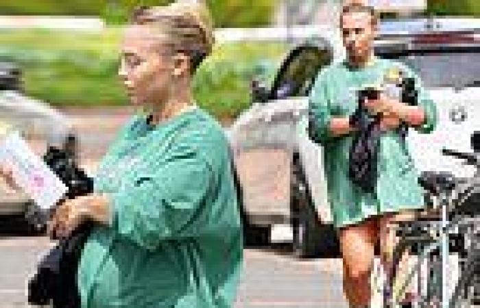 Tammy Hembrow shows off her baby bump in an oversized T-shirt as she leaves the ...