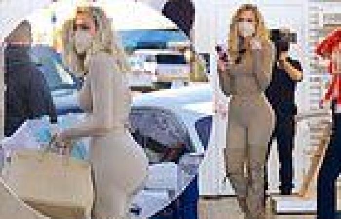 Khloe Kardashian parades her sensational figure in a skintight beige ensemble ...