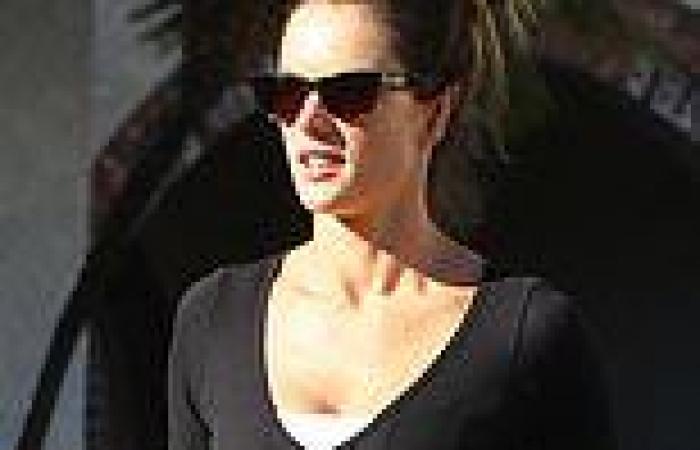 Alessandra Ambrosio shows off her toned abs in black gym set
