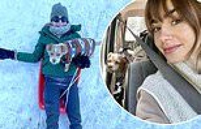 Lily Collins bundles up in green padded jacket as she enjoys snowy mountain ...