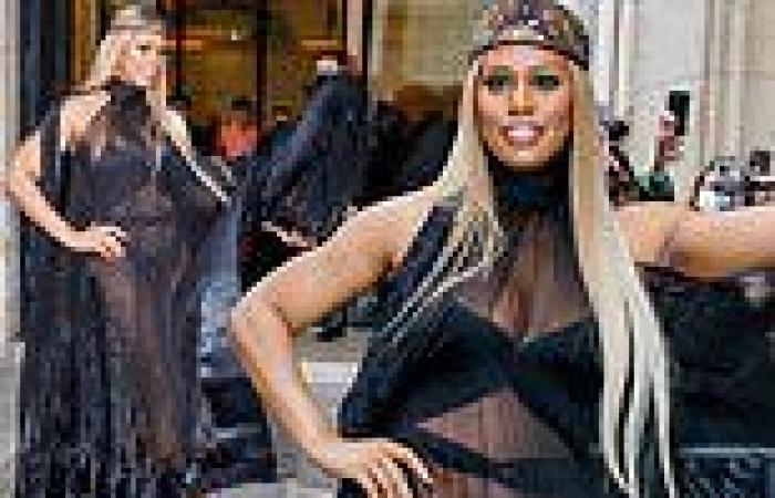 Laverne Cox flashes the flesh in a cut-out bodysuit beneath a sheer dress at ...
