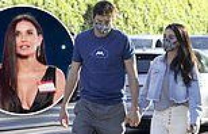 Mila Kunis holds hands with Ashton Kutcher... after starring in THAT ad with ...