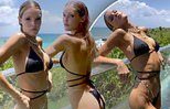 Victoria's Secret model Joy Corrigan makes the most of a black string bikini