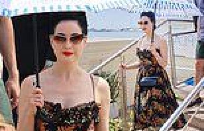 Wednesday 25 May 2022 03:16 PM Dita Von Teese looks typically chic in a corset-style flowery black dress trends now