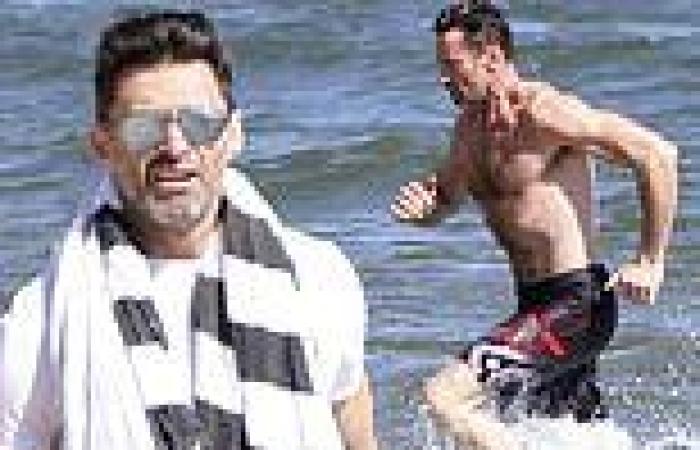 Monday 20 June 2022 11:13 PM Hugh Jackman puts his rippling abs on display as he goes for a swim in river trends now