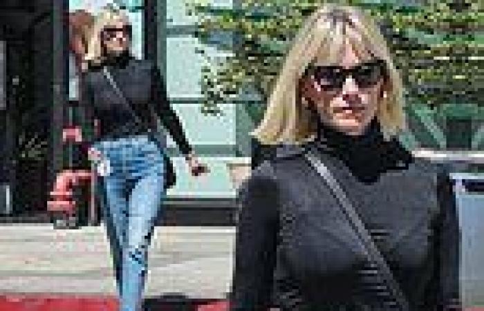 Tuesday 4 October 2022 11:06 PM January Jones looks slender in her slim-fit jeans and a skintight turtleneck trends now