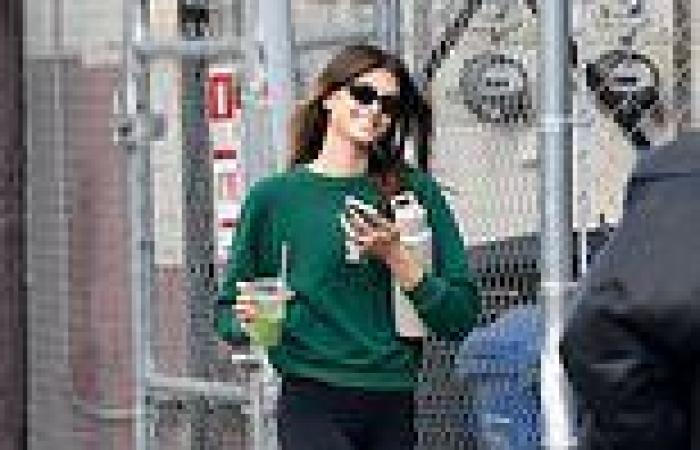 Kaia Gerber nails casual chic in a green sweater and tight leggings trends now