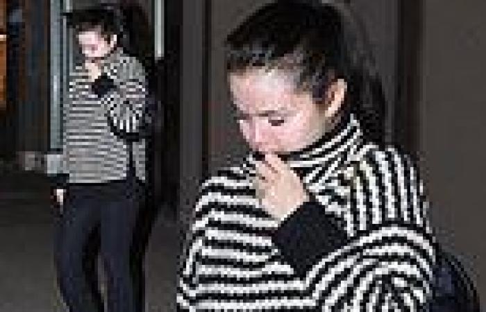 Selena Gomez bundles up in black and white sweater and leggings as she ... trends now