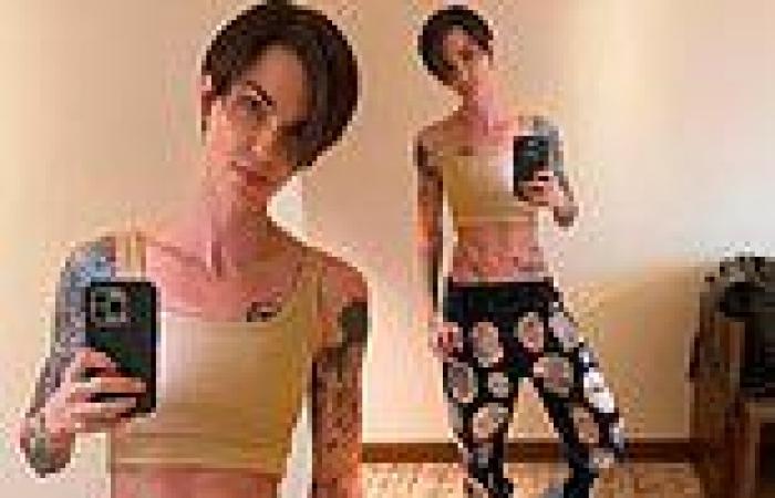 Ruby Rose shows off her tattooed and toned stomach trends now