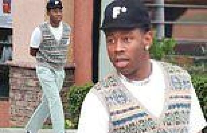 Tyler, the Creator looks relaxed in beige sweater vest and slacks while walking ... trends now