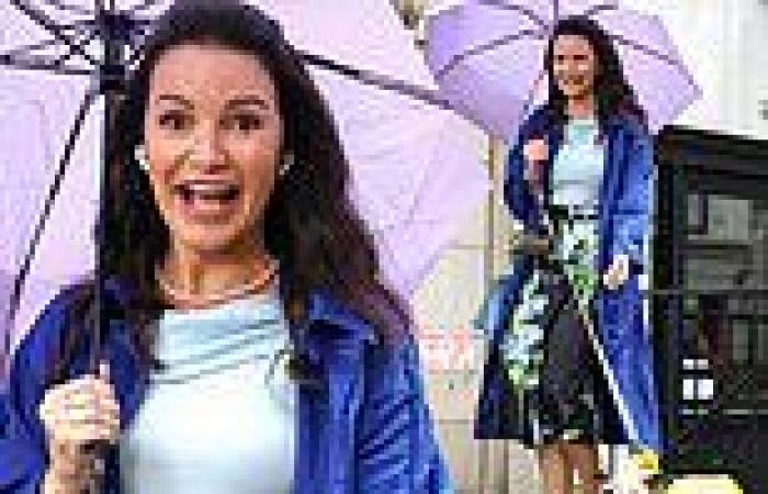 Kristin Davis braves the rain in a royal blue coat on the set of And Just Like ... trends now
