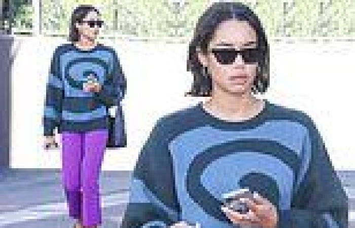 Laura Harrier cuts a stylish figure in a graphic sweater and purple trousers on ... trends now