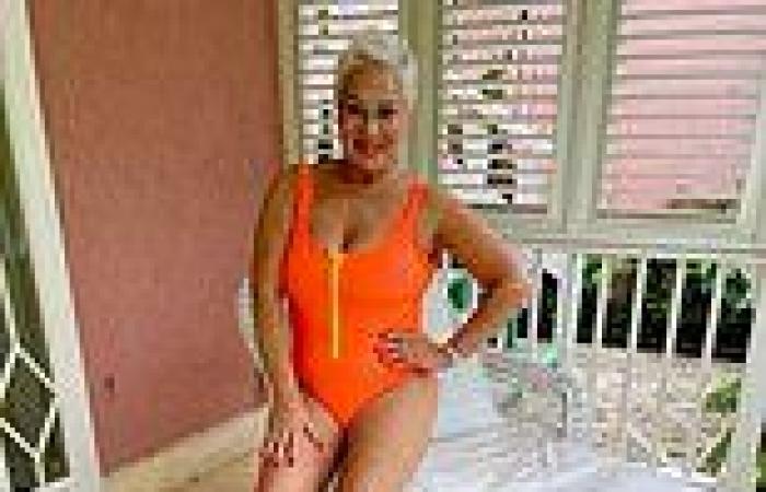 Denise Welch exhibits her enviable physique in a zip-up orange swimsuit trends now