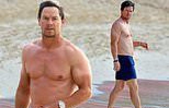 Mark Wahlberg shows off his T-shirt tan lines and muscular physique during ... trends now