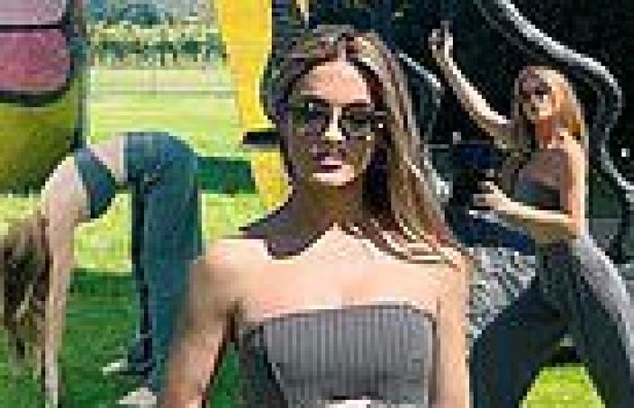 Selling Sunset star Chrishell Stause strikes poses in a tube top and trousers ... trends now