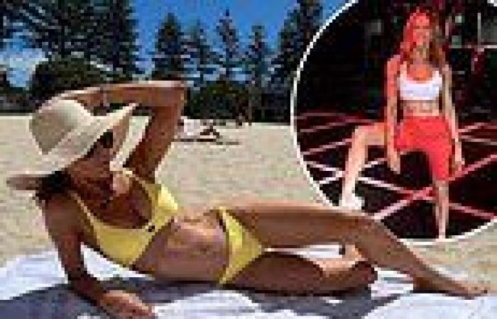 Ex-cricket WAG Kyly Clarke flaunts her ripped bikini body at a Queensland beach trends now
