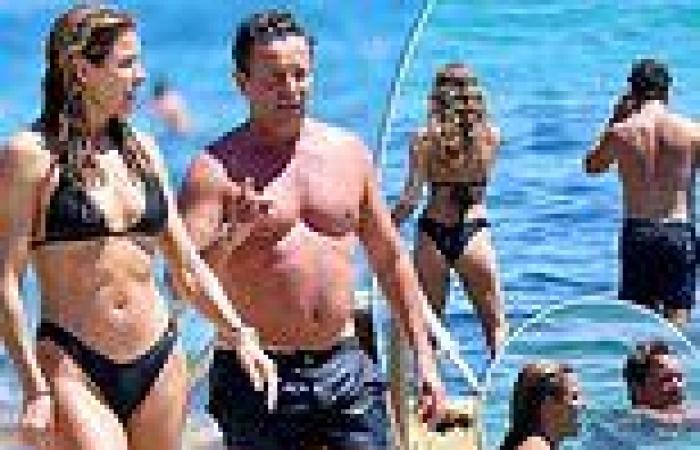 Steve Jacobs strips off and takes a dip with model Laura Csortan at Bondi Beach trends now