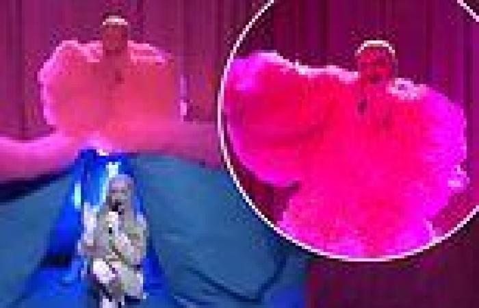 Sam Smith hid Kim Petras under their HUGE pink tulle skirt ahead of the duo's ... trends now