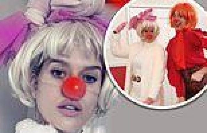 Alice Eve poses in a blonde wig and red nose as she larks around at a clown ... trends now