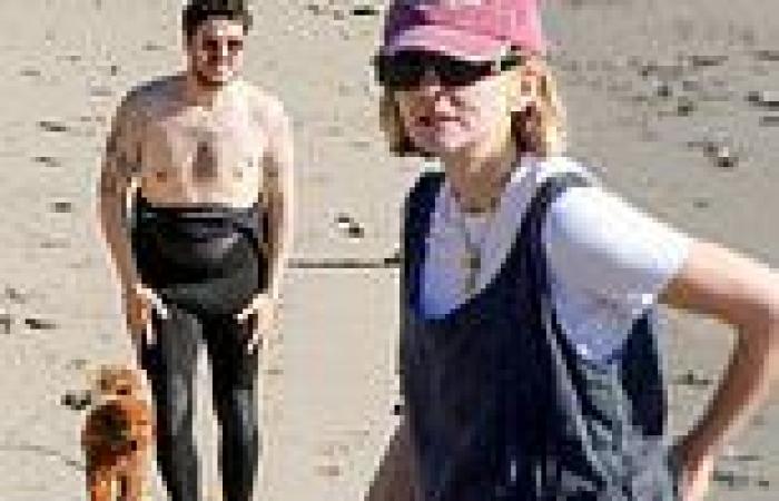 Carey Mulligan covers baby bump in overalls as she joins husband Marcus Mumford ... trends now