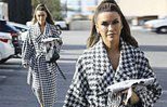Chrishell Stause is spotted in a long houndstooth trench coat while running ... trends now