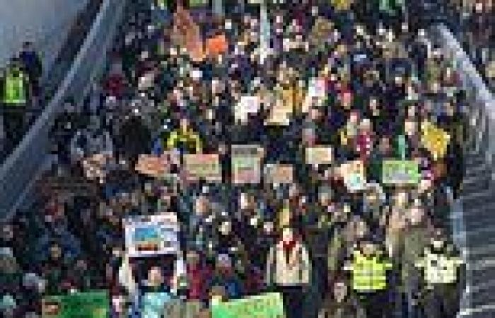 Hundreds of Extinction Rebellion protesters wave banners outside The Hague ... trends now