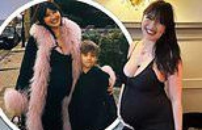 Pregnant Daisy Lowe cradles her growing baby bump in a plunging black maxi dress trends now