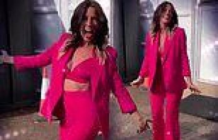 Davina McCall gives glimpse at her midriff in vibrant pink bra top trends now