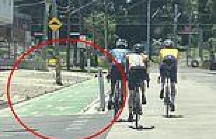 Cyclists hold up traffic as they ride on the road right next to a bike ... trends now