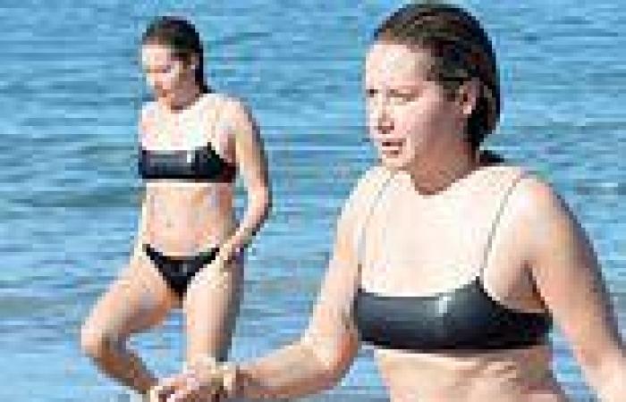 Ashley Tisdale sizzles in cheeky bikini as she splashes in the surf during ... trends now