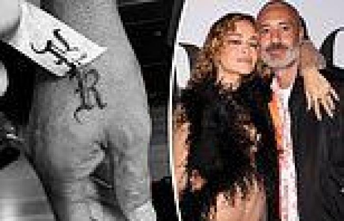 Rita Ora's husband Taika Waititi gets her first initial tattooed on his hand trends now