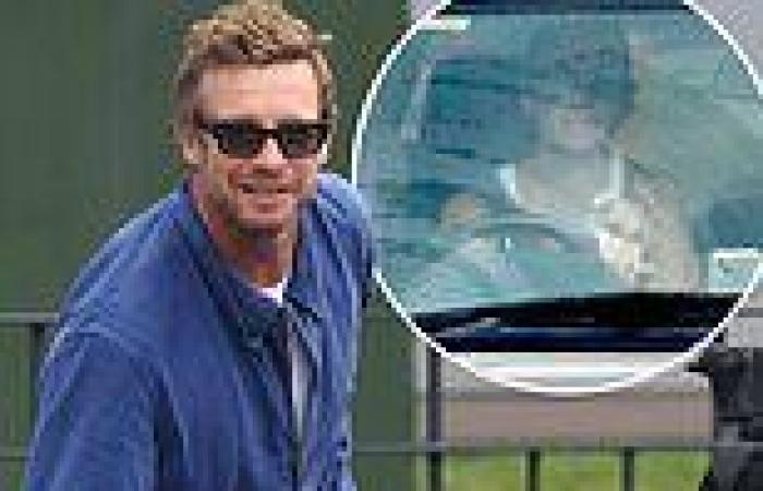 Simon Baker can't wipe the smile off his face as he's picked up from Sydney ... trends now