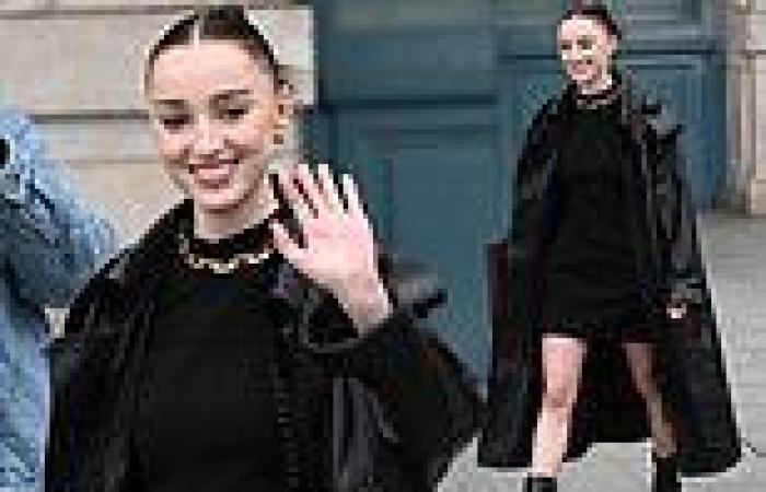 Phoebe Dynevor puts on a leggy display in black mini dress at Louis ...