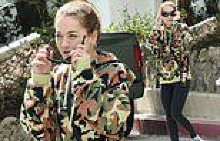 Make-up free Rita Ora cuts a sporty figure in a camouflage jumper and leggings trends now
