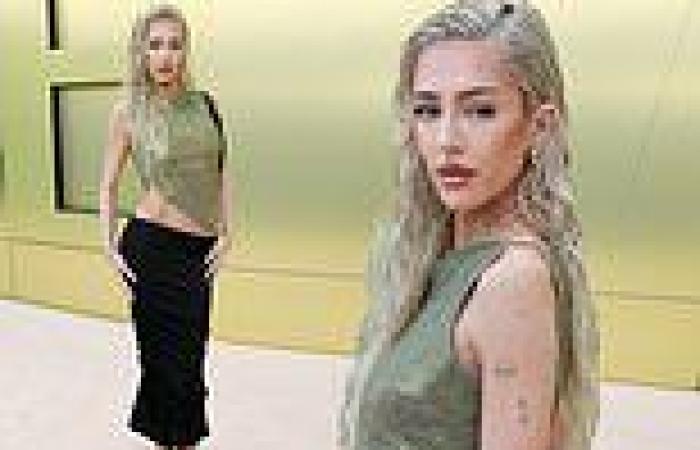Delilah Hamlin shows off her toned midriff  in sparkly green top trends now