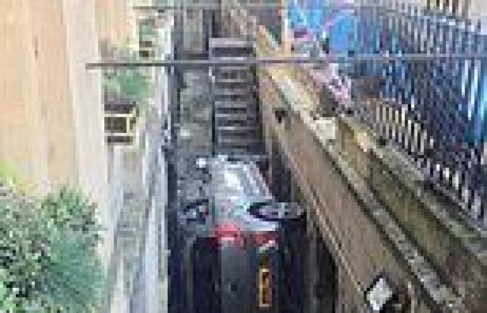 Tight squeeze! Car gets wedged in basement alley outside historic Bath hotel trends now