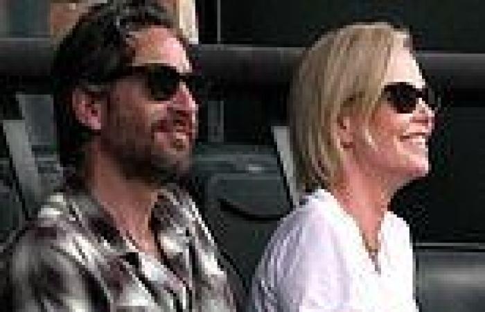 Charlize Theron beams beside handsome mystery man as she watches BNP Paribas ... trends now