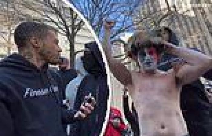 Moment Antifa infiltrator screams at protestor in 'Trump Shaman' outfit for ... trends now