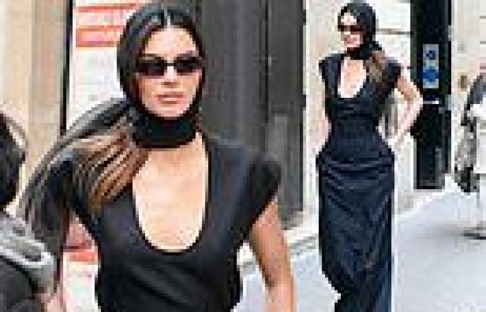 Kendall Jenner cuts a chic figure in a plunging black gown in Paris trends now