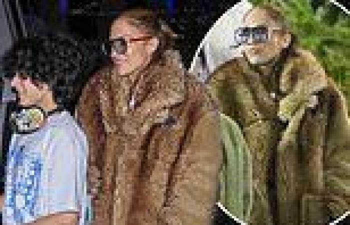 Jennifer Lopez stuns in oversized camel fur as she exits SZA's concert with ... trends now