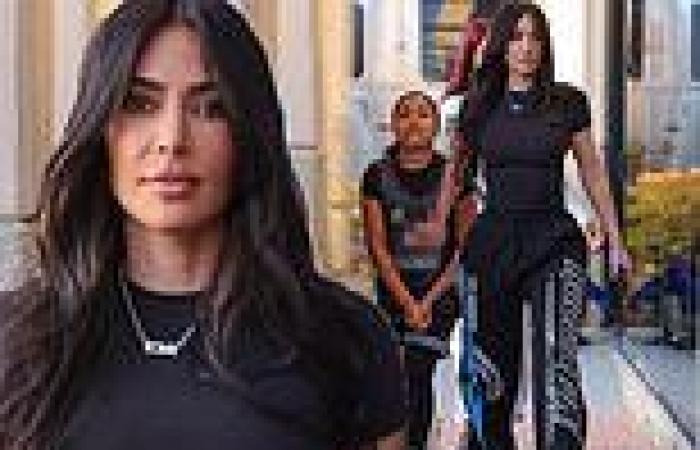 Kim Kardashian flaunts her figure in skintight t-shirt as she attends daughter ... trends now