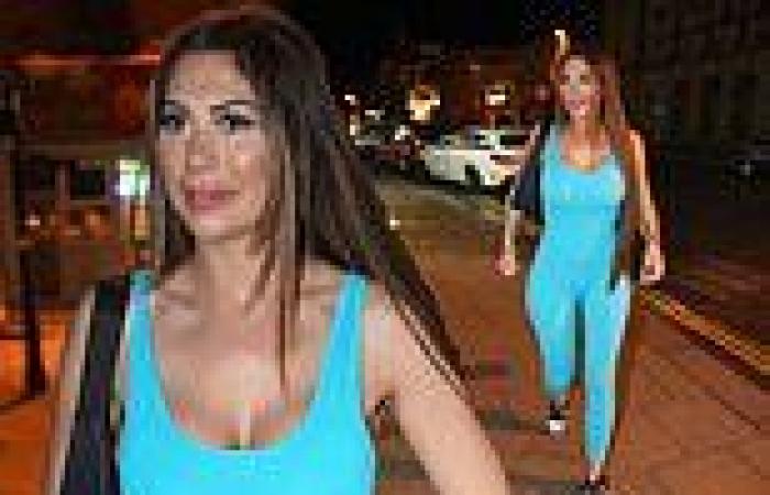 Braless Chloe Ferry wows in a skin tight blue plunging jumpsuit as she parties ... trends now