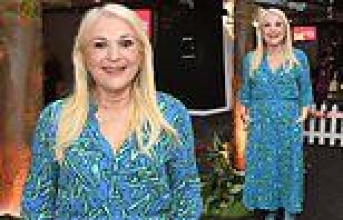 Newly-single Vanessa Feltz looks happy as she poses in a pretty blue dress trends now