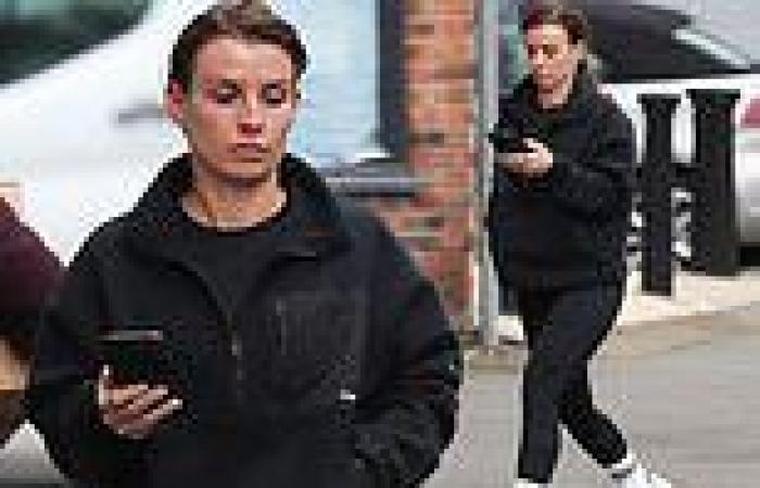 Coleen Rooney is glued to her phone as she keeps busy while Wayne spends time ... trends now