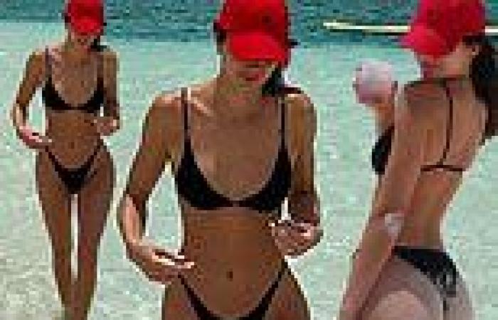 Kendall Jenner showcases her toned physique in a black bikini while plugging ... trends now