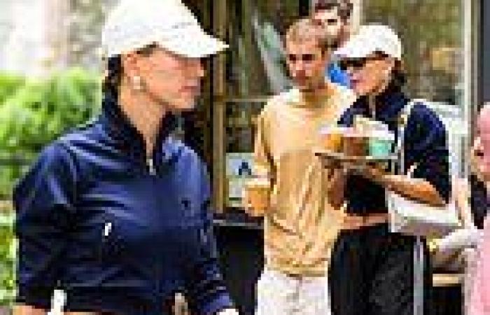 Hailey Bieber shows off toned abs in a cropped jacket with husband Justin to ... trends now
