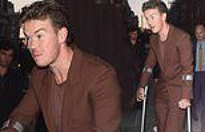 Will Poulter supports himself on crutches as heads on a night out trends now