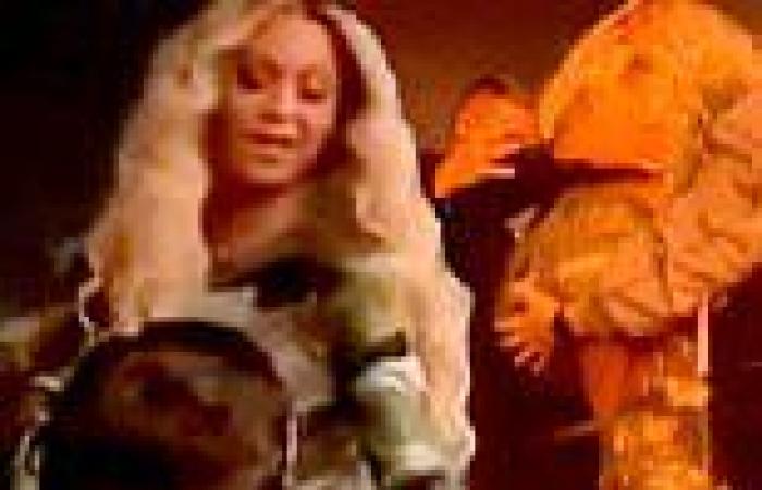 Beyonce gets some handsy help from a crew member as fans think he grabbed her ... trends now