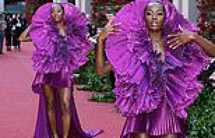 AJ Odudu puts on a very leggy display in a show-stopping purple mini dress with ... trends now